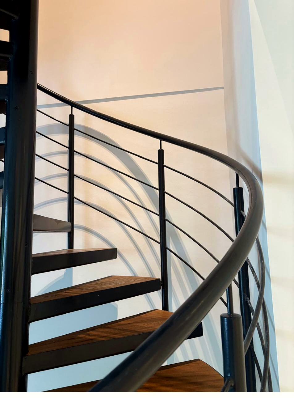 Spiral staircase in black metal and wood, repainted, Geneva